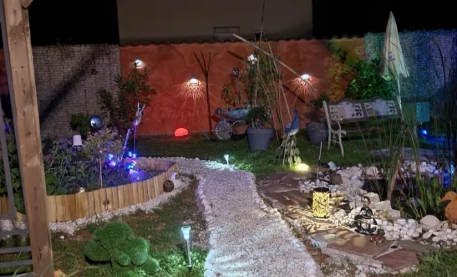 Aménagement extérieur vue de nuit à Péronnas